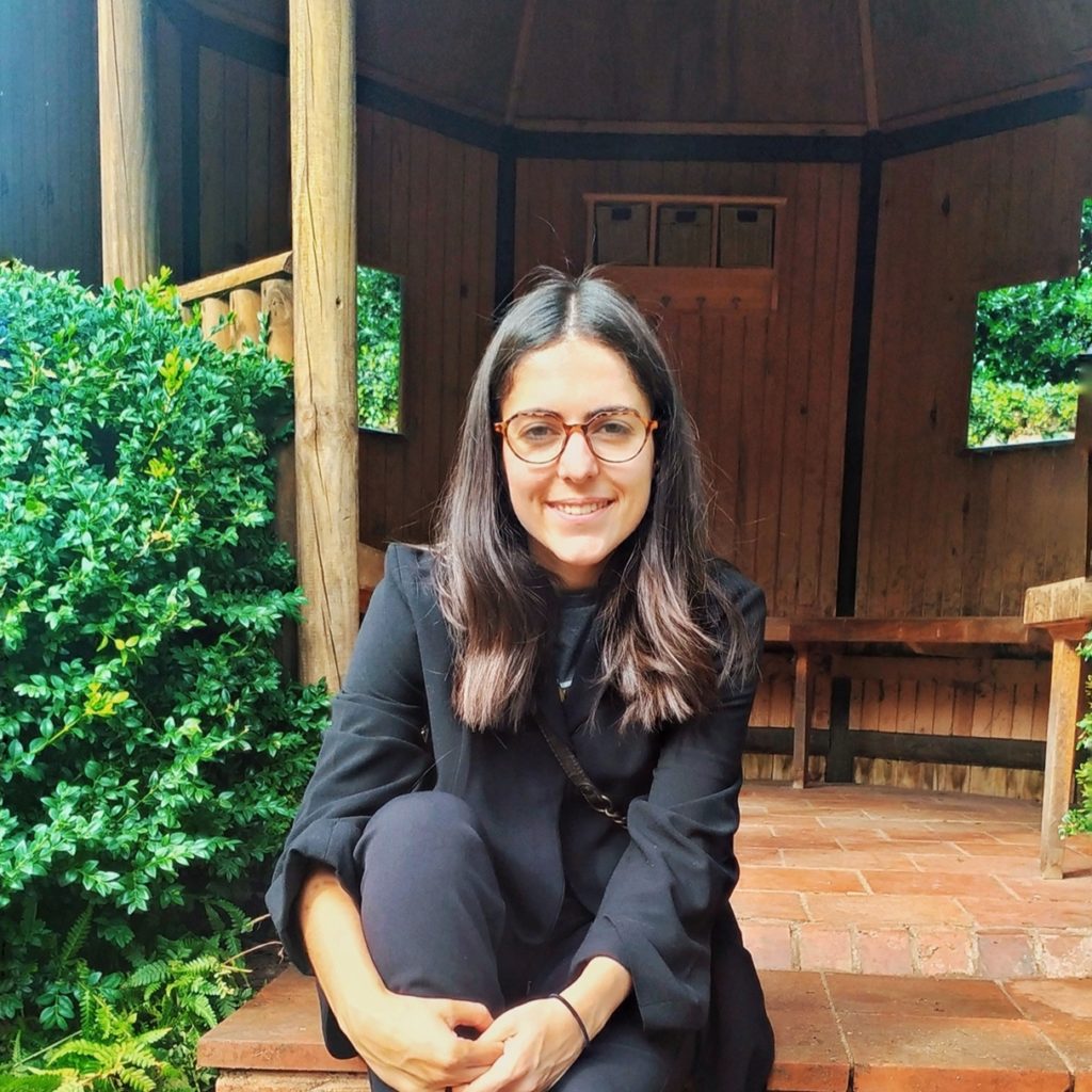 Ainhoa sits in front of Wightwick Manor Gardens